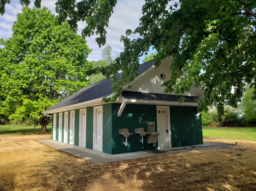 Completed bathhouse exterior at Camp Pecometh
