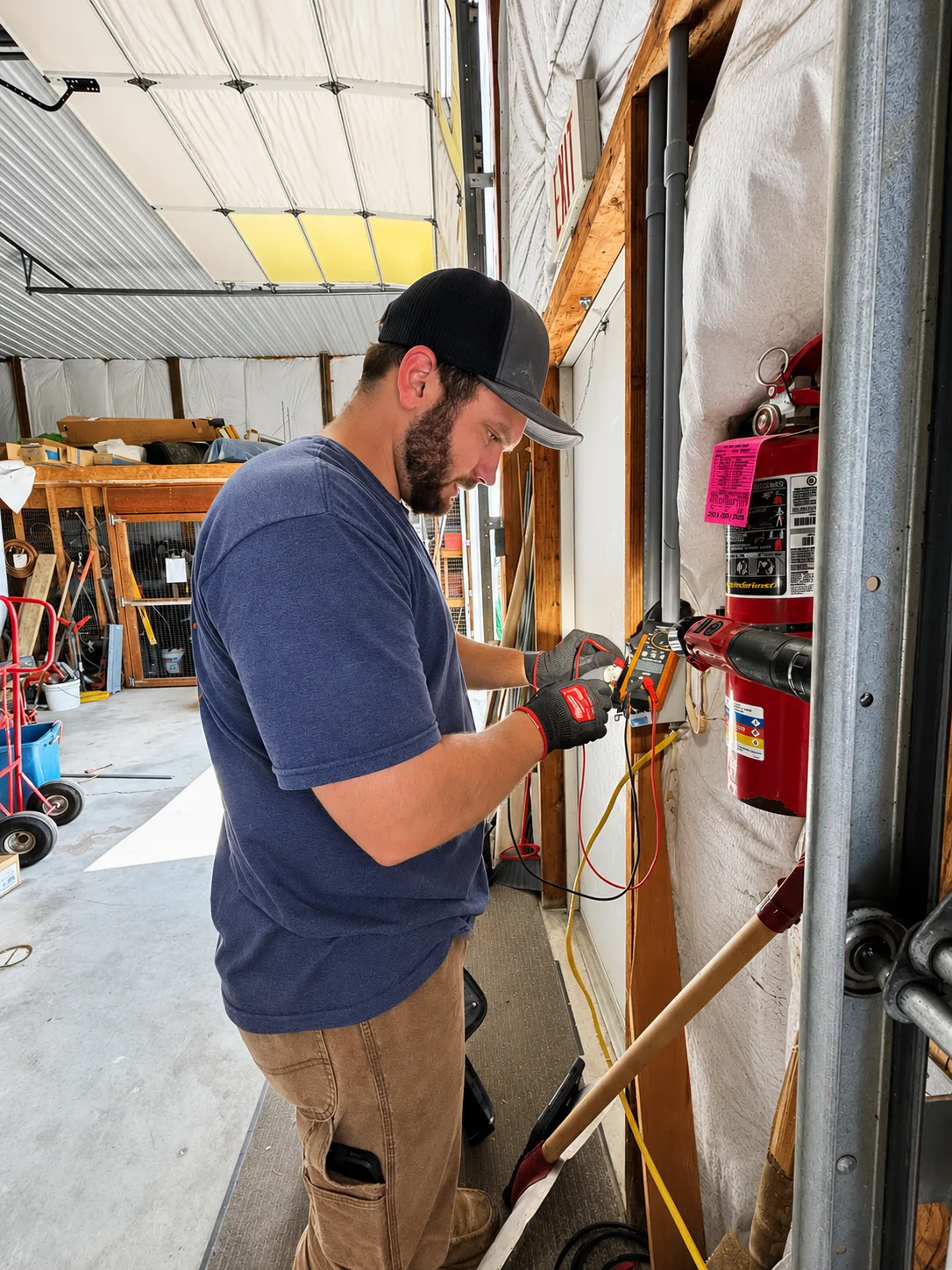 Collins Mechanical electrical technician testing wiring with a meter